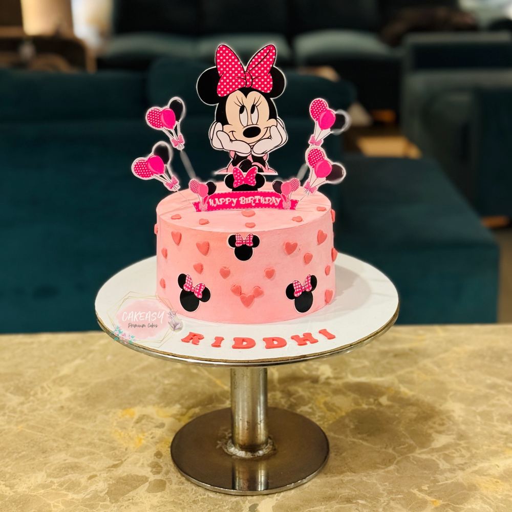 Pink Minnie Mouse theme birthday cake
