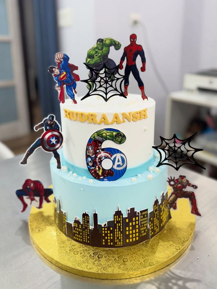 Two-tier superhero theme birthday cake