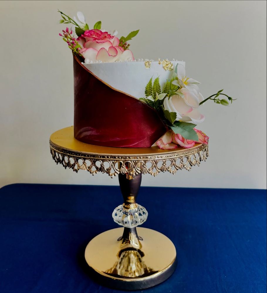 Ivory and burgundy wrap cake with roses
